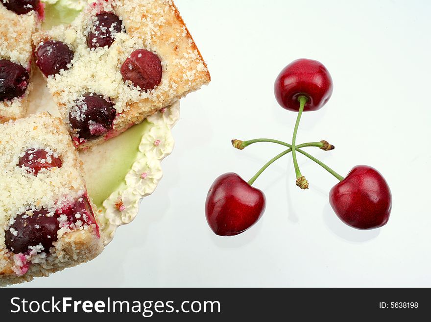 Homemade shortcake with cherries on white background. Homemade shortcake with cherries on white background