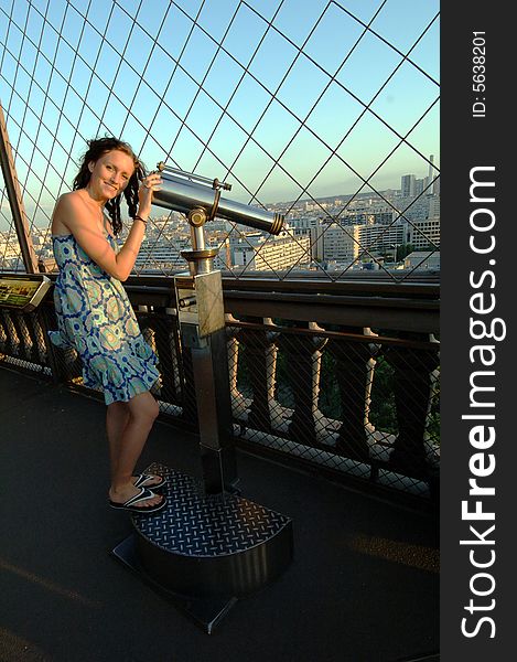 Woman With Telescope On Eiffel Tower