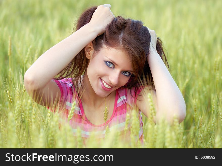 Portrait of the beautiful girl in wheat field. Portrait of the beautiful girl in wheat field