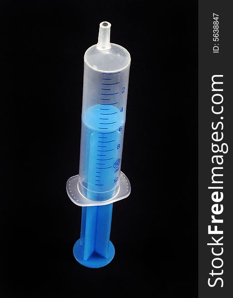Injection vaccine dose isolated on blue background