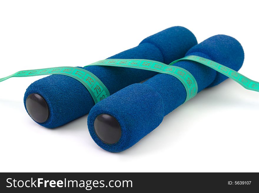 Dumbbells and measuring tape isolated on white background