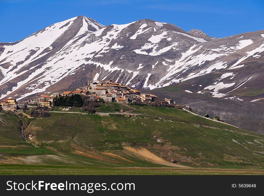 Wide angle shot of Castelluccio, a typical Italian mountain village, with very snowy winter.