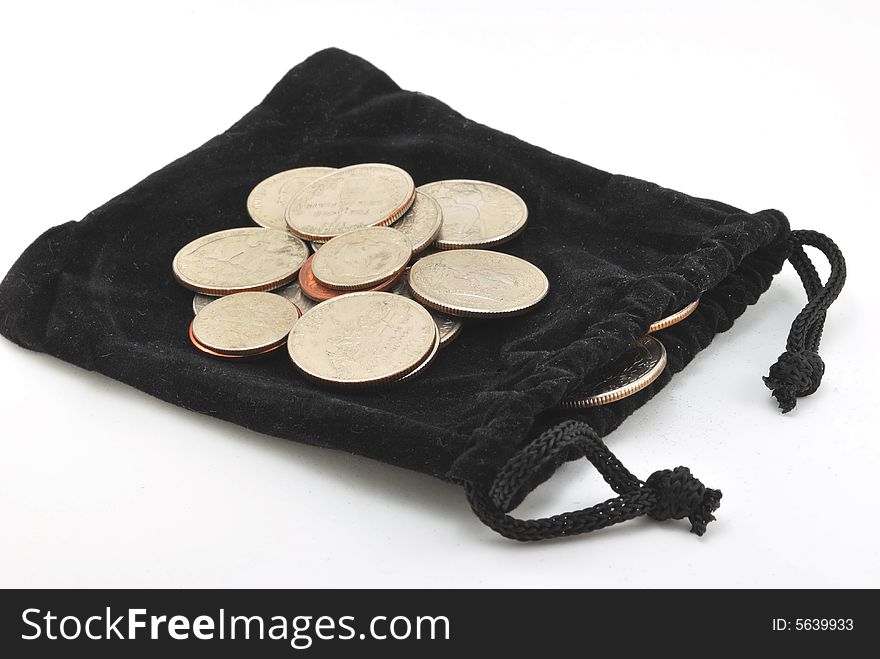 Several coins on a black velvet bag. Several coins on a black velvet bag