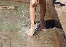 Girl S Feet Playing In The Fountain Royalty Free Stock Photos