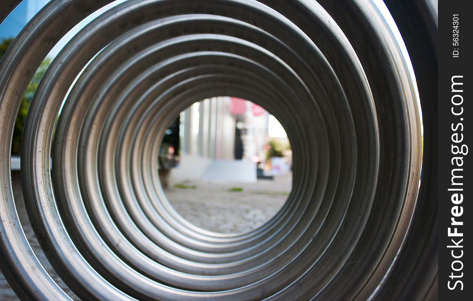 Front view of large metal spiral as an abstract background outside