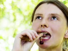 Woman Eating Sour Cherry Royalty Free Stock Photos Woman Eating Sour Cherry Royalty Free Stock Photos