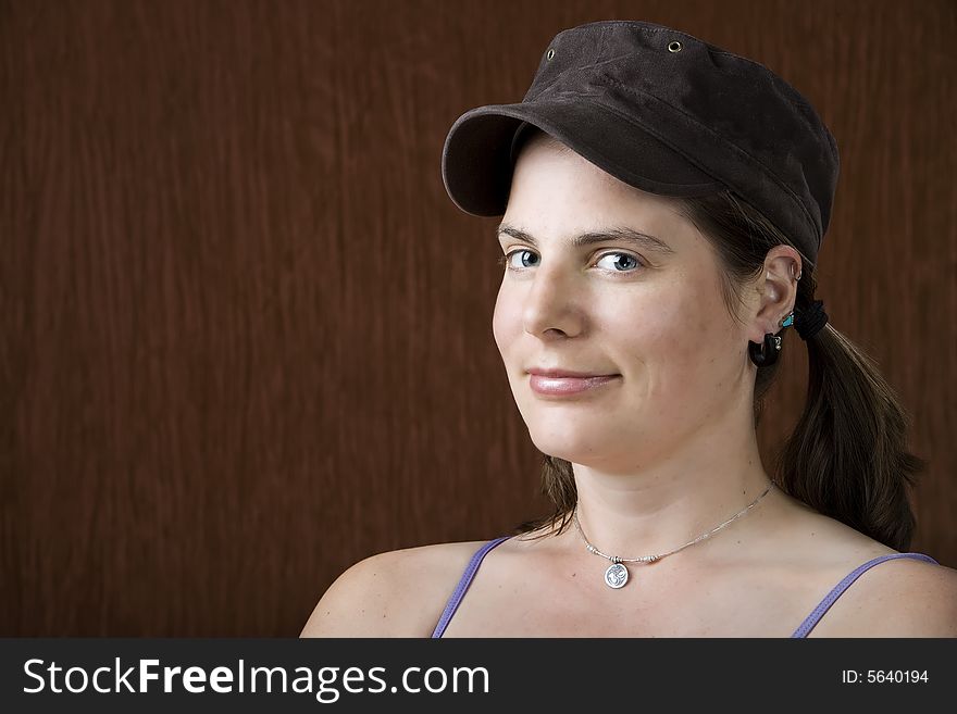 Closeup of woman with blue eyes wearing a cap