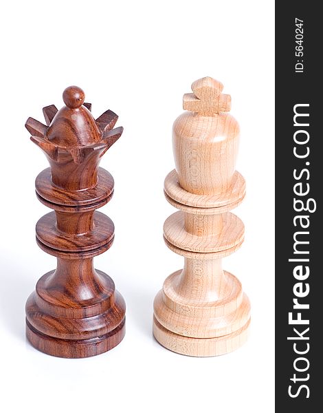 Two chess pieces standing beside each other.