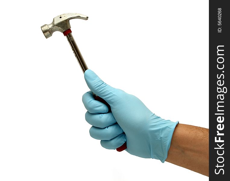 Hand in blue gloves holding and old hammer isolated in white