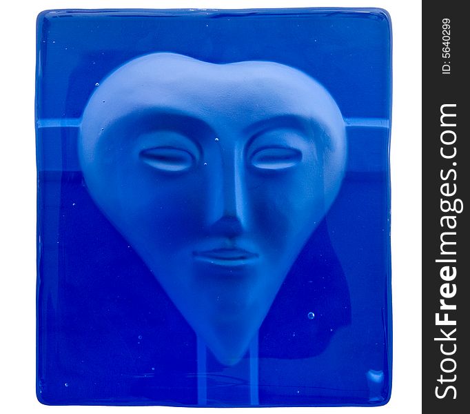Alien face in blue glass block. Alien face in blue glass block