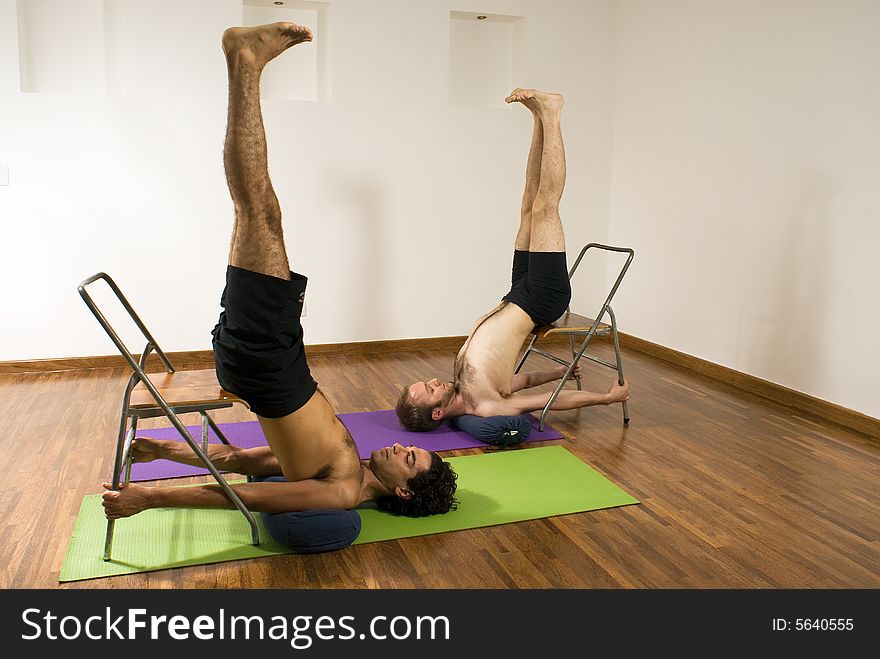 Two men at a yoga studio. Two men at a yoga studio