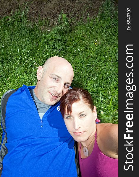 Couple Sitting on the Grass  - Vertical