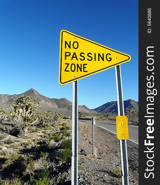 Close-up of road sign posted along street. Vertically framed shot. Close-up of road sign posted along street. Vertically framed shot.