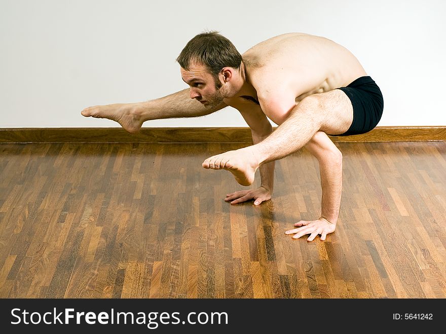 Man in a Yoga Crouch - Horizontal