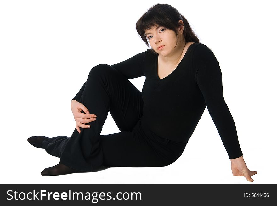 Serenity (sitting and relaxing woman in black gym suit isolated on white). Serenity (sitting and relaxing woman in black gym suit isolated on white)
