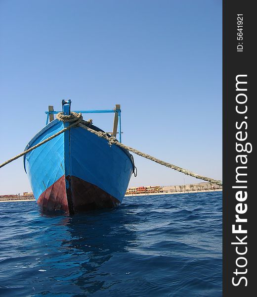 Blue boat in the harbor of Abu Dabbab, Marsa Alam, Egypt