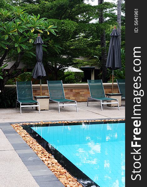 Swimming pool scene at a tropical resort.