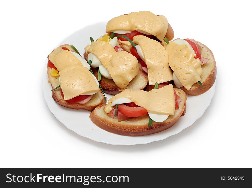 Home-made sandwiches with cheese, sausage and tomato on a black background. Home-made sandwiches with cheese, sausage and tomato on a black background