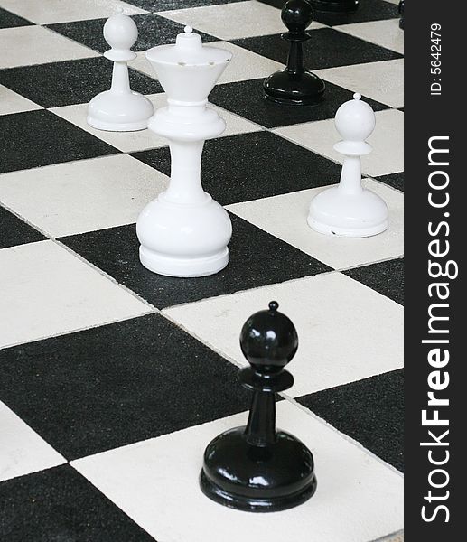 Chess pieces on a board.