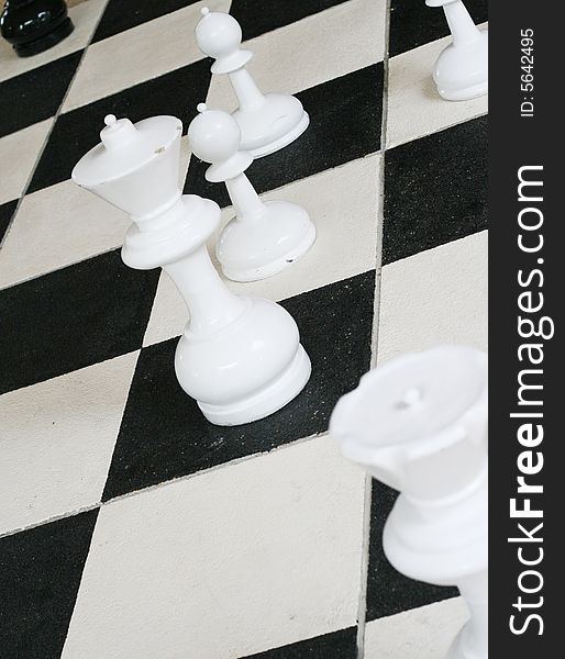 Chess pieces on a board.
