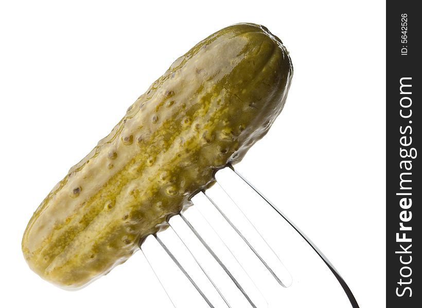 Crackling pickled gherkins on a plug on a white background