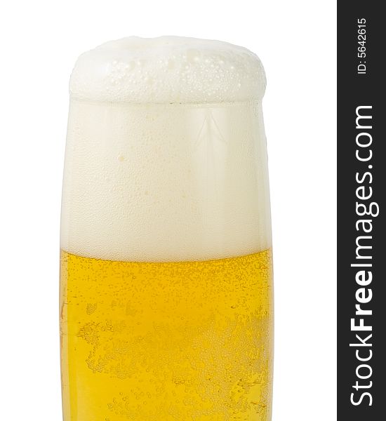 Fresh foamy beer in a glass on a white background.