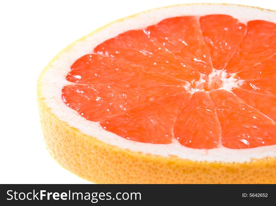 Fresh juicy grapefruit. Close up on a white background. Fresh juicy grapefruit. Close up on a white background.