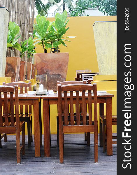 Wooden table and chairs in a modern decor. Wooden table and chairs in a modern decor.