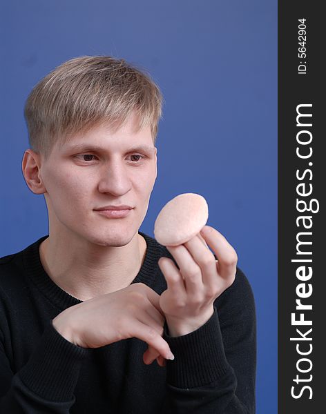 Young man prepares for photographing. Young man prepares for photographing