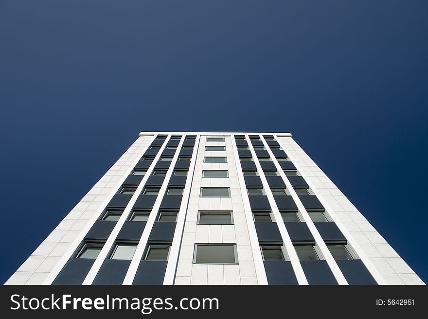 A skyscraper in the blue sky