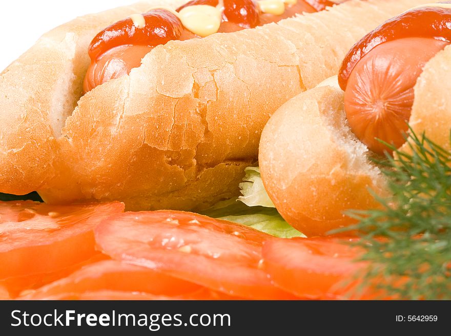 Hot dogs with vegetables isolated on a white background