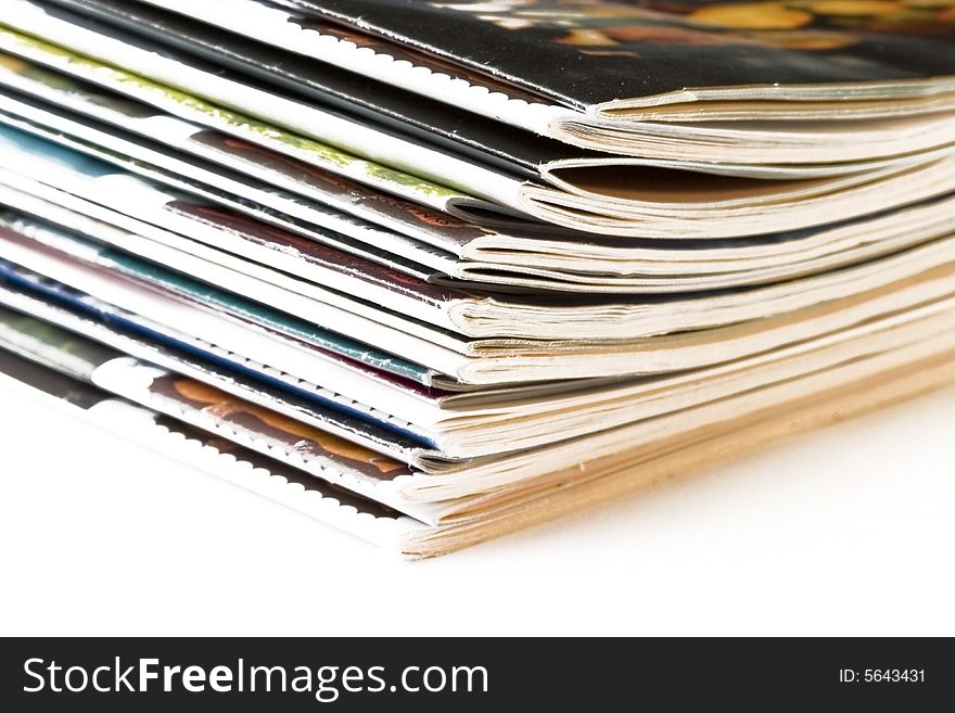 Stack of newspapers on white background