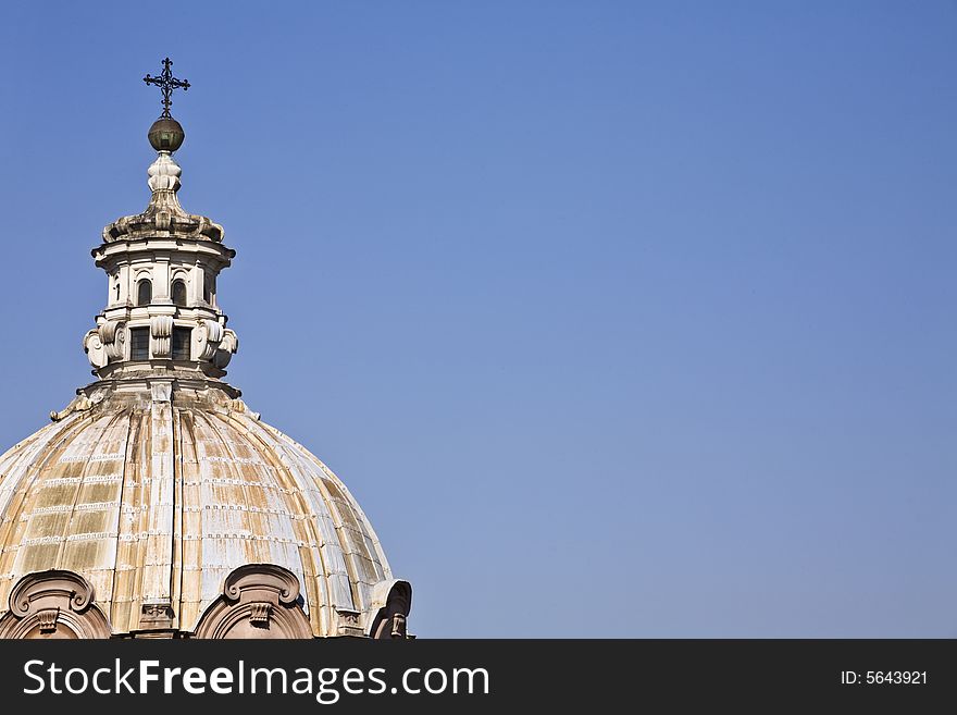 A dome of roman Church in a blue sky. A dome of roman Church in a blue sky