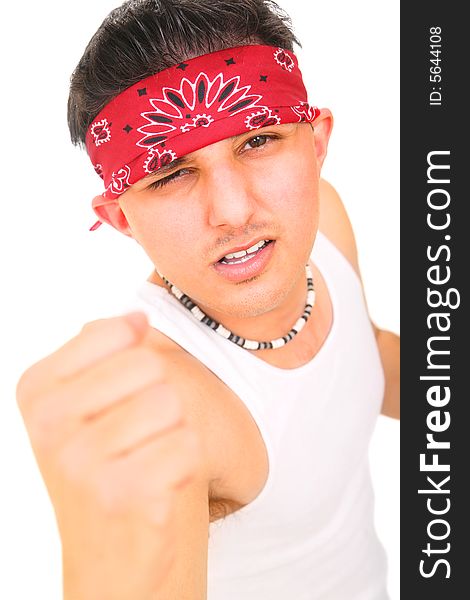 Young rocker/punk showing his fist and angry expression. isolated on white background. Young rocker/punk showing his fist and angry expression. isolated on white background