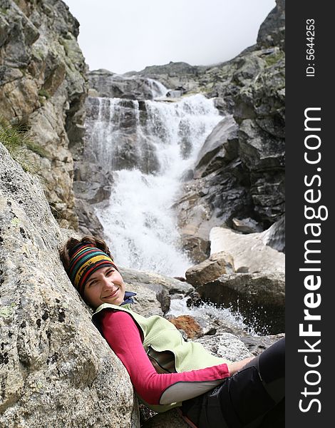 Girl near the waterfall, caucasus