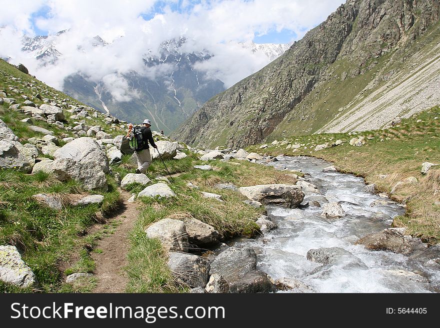 Hikers on the cliff in mountain,. Hikers on the cliff in mountain,