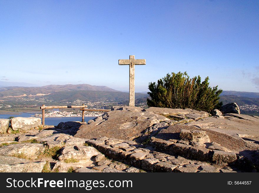 Stone cross in landscape of Portugal