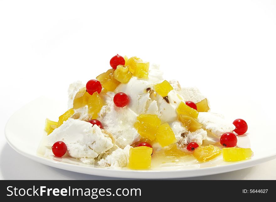 Vanilla ice-cream with pineapples and red currant
