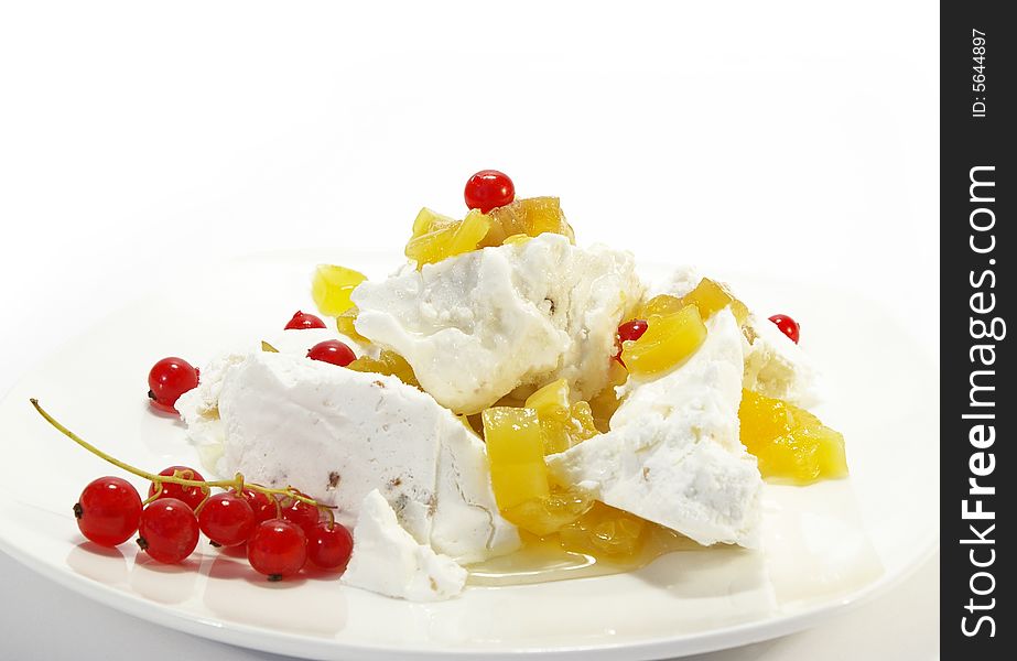 Vanilla ice-cream with pineapples and red currant