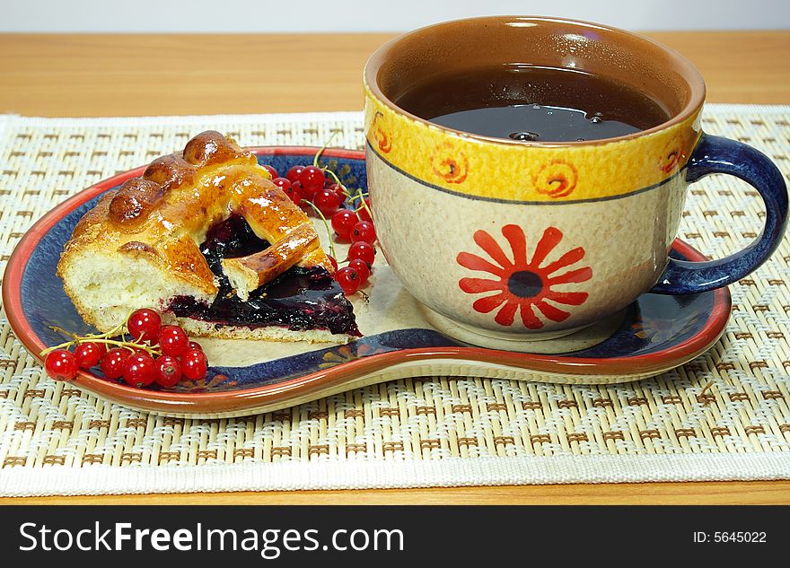 Fresh sweet pie with bilberry and cup of tea. Fresh sweet pie with bilberry and cup of tea