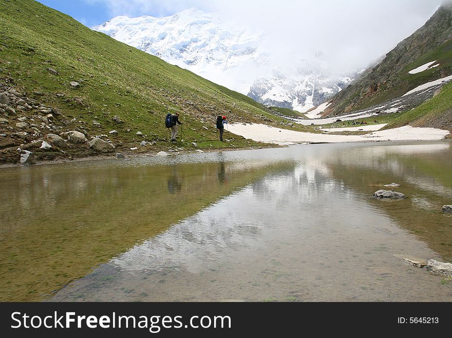 Hikers on the cliff in mountain,. Hikers on the cliff in mountain,