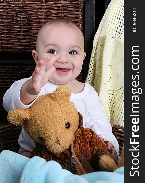 Six month old baby sitting infront of wooden drawers. Six month old baby sitting infront of wooden drawers