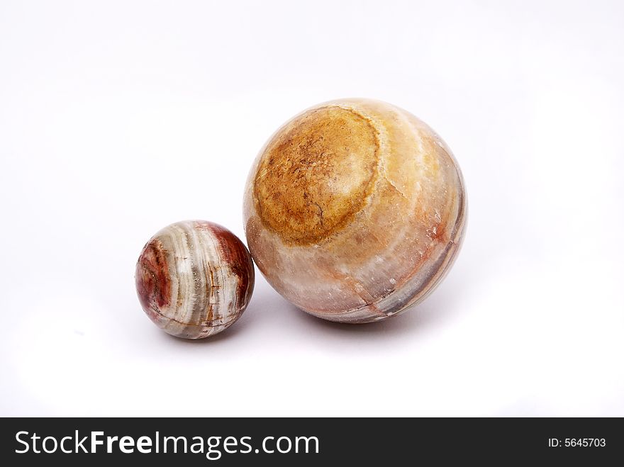 Two spheres from a greenstone on a white background