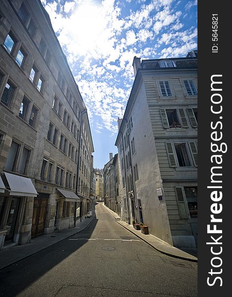 Wide angle view of a narrow street in Geneva, Switzerland.