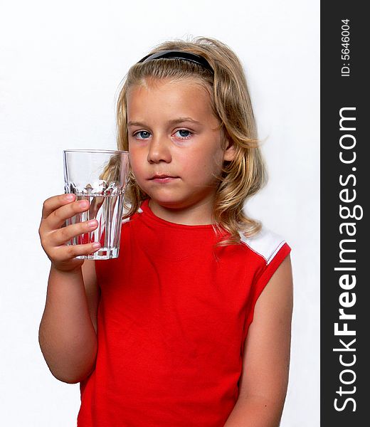 Boy showing a glass of water on a white background. Boy showing a glass of water on a white background.