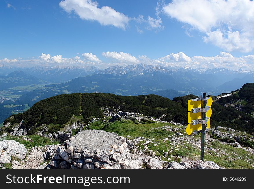 Clouds above the mountains Austrian  Alpes . The snow on the rocks. Sight from the peak of Untersberg mountain .Not so far from Salzburg . Clouds above the mountains Austrian  Alpes . The snow on the rocks. Sight from the peak of Untersberg mountain .Not so far from Salzburg .