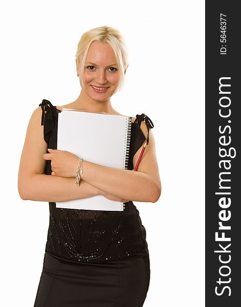 Smiling young blonde woman holding a notebook