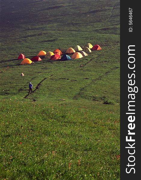 Colorful tents and traveller on the mountain. Colorful tents and traveller on the mountain