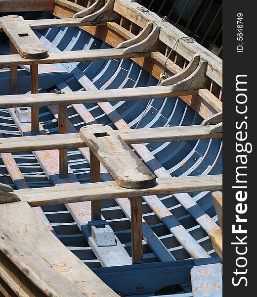 Close-up of old fishing Greek boat. Great craftsmanship makes for a very sturdy boat and interesting photo. Close-up of old fishing Greek boat. Great craftsmanship makes for a very sturdy boat and interesting photo.