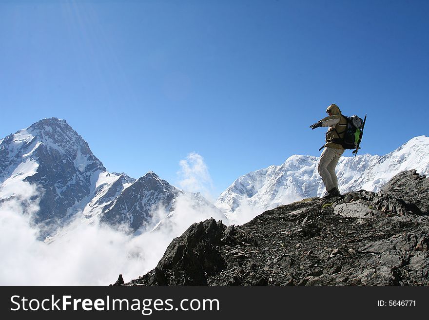 Hiker on the cliff in mountain, Backpacker
